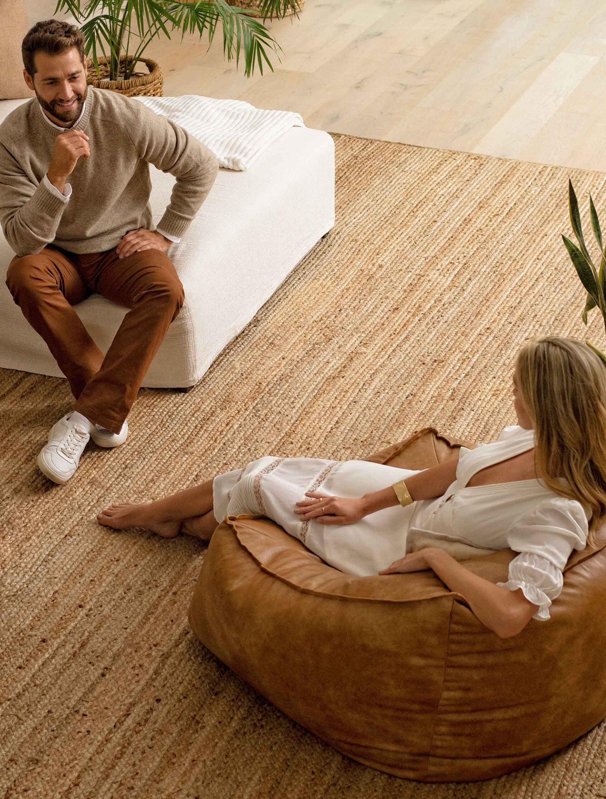Couple lounging on living room furniture